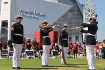 U.S. Marines with the United States Marine Corps Silent Drill Platoon execute their "double inspection" sequence during a performance at the College Football Aflac Kickoff show during Marine Week Atlanta in Atlanta, Ga., Aug. 31, 2025. The year 2025 marks the 250th anniversary of the United States Marine Corps, a milestone that highlights the legacy, transformation and enduring spirit of the Corps since 1775. Throughout the year, Marines across the globe will commemorate this anniversary by honoring the service and sacrifice of those who served before them and by remaining faithful to the motto Semper Fidelis. (U.S. Marine Corps photo by Cpl. Christopher Prelle)
