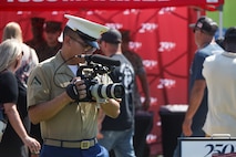 U.S. Marine Corps Lance Cpl. Elijua Guel, combat videographer, captures video footage during Marine Week Atlanta in Atlanta, Ga., Aug. 31, 2025. The year 2025 marks the 250th anniversary of the United States Marine Corps, a milestone that highlights the legacy, transformation and enduring spirit of the Corps since 1775. Throughout the year, Marines across the globe will commemorate this anniversary by honoring the service and sacrifice of those who served before them and by remaining faithful to the motto Semper Fidelis. (U.S. Marine Corps photo by Cpl. Christopher Prelle)