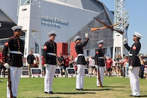 U.S. Marines with the United States Marine Corps Silent Drill Platoon execute their "double inspection" sequence during a performance at the College Football Aflac Kickoff show during Marine Week Atlanta in Atlanta, Ga., Aug. 31, 2025. The year 2025 marks the 250th anniversary of the United States Marine Corps, a milestone that highlights the legacy, transformation and enduring spirit of the Corps since 1775. Throughout the year, Marines across the globe will commemorate this anniversary by honoring the service and sacrifice of those who served before them and by remaining faithful to the motto Semper Fidelis. (U.S. Marine Corps photo by Cpl. Christopher Prelle)