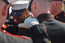 U.S. Marines with the United States Marine Corps Silent Drill Platoon speak with each other before their performance at the College Football Aflac Kickoff show during Marine Week Atlanta in Atlanta, Ga., Aug. 31, 2025. The year 2025 marks the 250th anniversary of the United States Marine Corps, a milestone that highlights the legacy, transformation and enduring spirit of the Corps since 1775. Throughout the year, Marines across the globe will commemorate this anniversary by honoring the service and sacrifice of those who served before them and by remaining faithful to the motto Semper Fidelis. (U.S. Marine Corps photo by Cpl. Christopher Prelle)