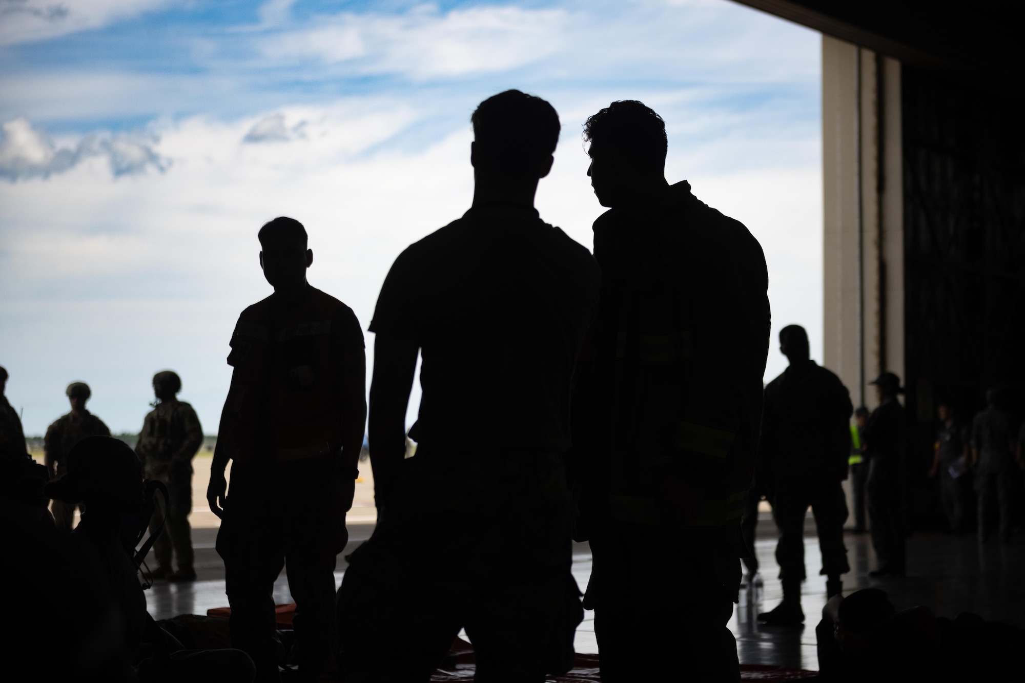 U.S. Air Force Airmen assigned to the 35th Medical Group and 35th Civil Engineer Squadron survey simulated patients during an aircraft mass casualty exercise.