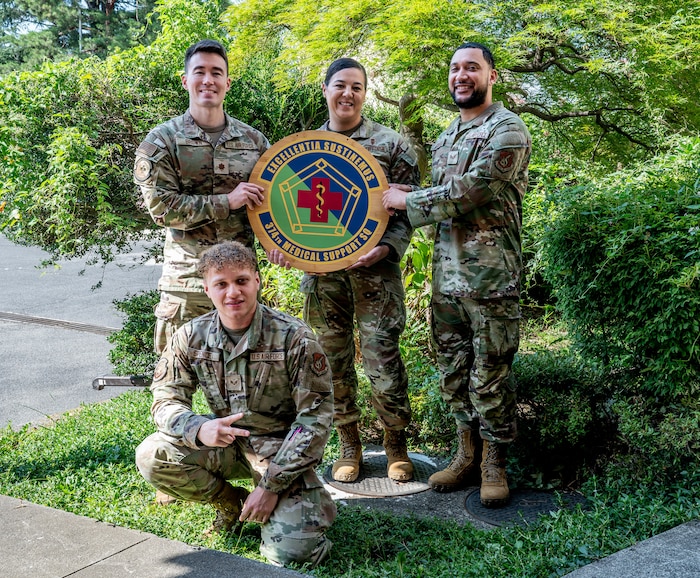 Members assigned to the 374th Medical Support Squadron pose for a group photo.