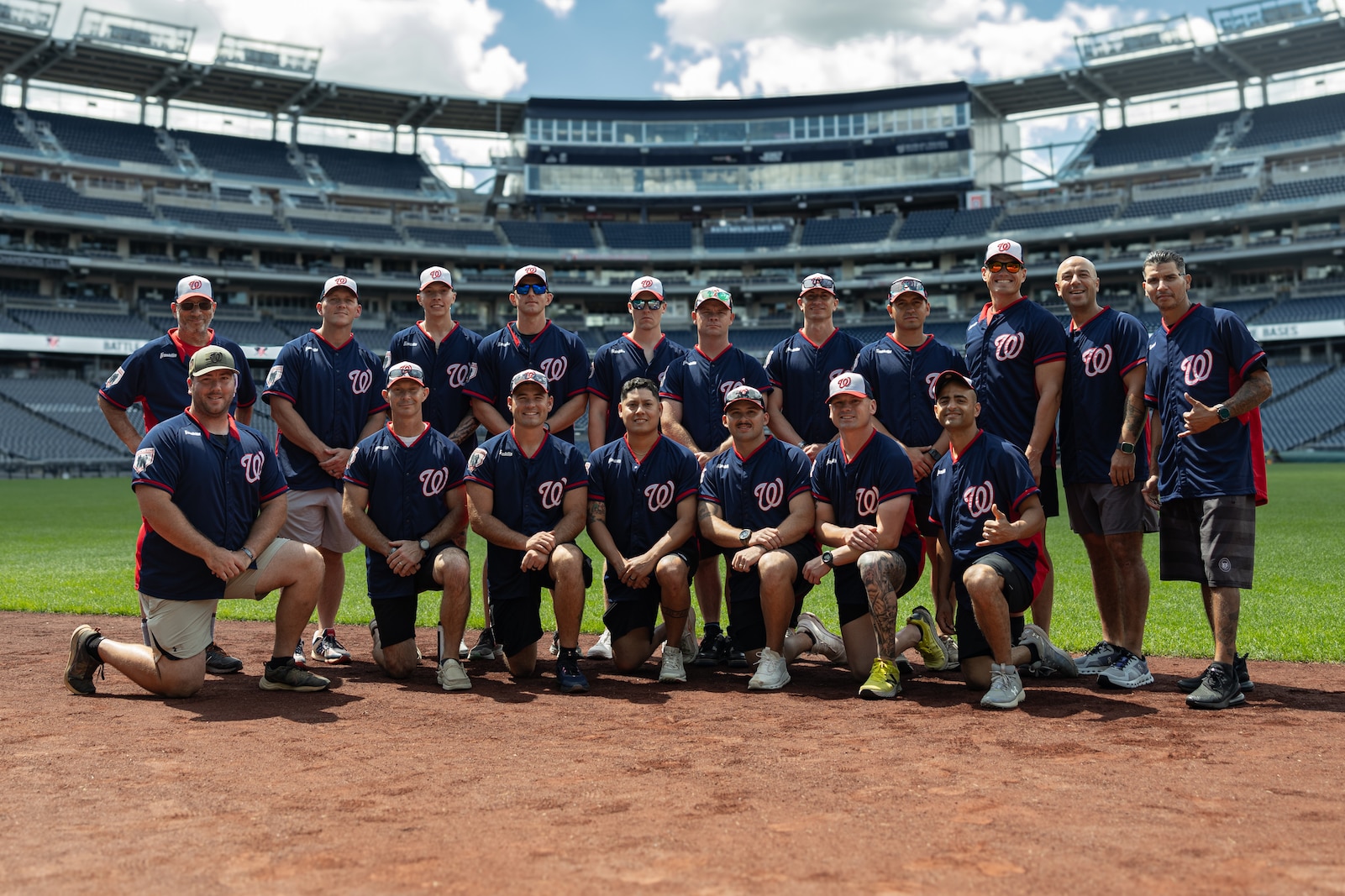 U.S. Marines apart of the Marine Corps Base Quantico softball team, poses for a photo at Nationals Park, Washington D.C., Aug. 26, 2025. Battle of the Bases is a military softball tournament, presented by the Washington Nationals, that serves as an extension of the intramural season at each of the military bases in the National Capital Region. (U.S. Marine Corps photo by Sgt. Dean Gurule)