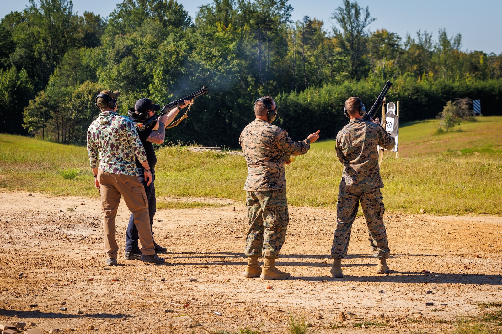 U.S. Marines and civilian police officers with the Security Battalion Counter Drone Team, shoot at an Unmanned Aerial System during an aerial target engagement simulation on Marine Corps Base Quantico, Virginia, August 27, 2025. This simulation is part of MCB Quantico’s Counter-Unmanned Aerial System’s Counter-Drone Team, which focuses on establishing standard operating procedures for the use of kinetic defeat options for law enforcement against a drone incursion. (U.S. Marine Corps photo by Lance Cpl. Jeffery Stevens)