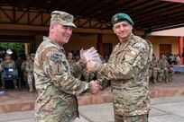 U.S. Army South Commander Maj. Gen. Philip Ryan presents Chilean General de Brigada Claudio Mardones Petermann, commander of the 3rd Mountain Division, with a gift during the closing ceremony for Exercise Southern Vanguard 25 in Los Ángeles, Chile, Aug. 29, 2025. Exercise Southern Vanguard 25 underscores the U.S. Army’s enduring commitment to regional partnership as U.S. forces deploy to Chile to conduct combined mountain warfare, field, and command post training alongside Chilean forces, with participation from Argentina and Peru - strengthening interoperability, shared readiness, and mutual trust while advancing regional security and cooperation across the Western Hemisphere. (U.S. Army National Guard photo by Sgt. 1st Class Sebastian Rothwyn)