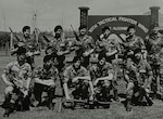 Lyndon Deboma (bottom right), chief of information protection for the 194th Wing, poses for a photo with the 1989 10th Security Police Squadron’s ‘Peacekeeper Challenge’ team on RAF Alconbury, U.K. Deboma’s team placed first in the tactics event known as the ‘Defender Challenge.’ (Courtesy photo)