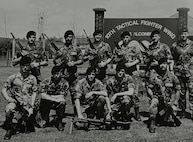 Lyndon Deboma (bottom right), chief of information protection for the 194th Wing, poses for a photo with the 1989 10th Security Police Squadron’s ‘Peacekeeper Challenge’ team on RAF Alconbury, U.K. Deboma’s team placed first in the tactics event known as the ‘Defender Challenge.’ (Courtesy photo)