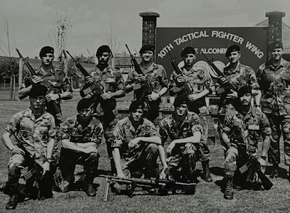 Lyndon Deboma (bottom right), chief of information protection for the 194th Wing, poses for a photo with the 1989 10th Security Police Squadron’s ‘Peacekeeper Challenge’ team on RAF Alconbury, U.K. Deboma’s team placed first in the tactics event known as the ‘Defender Challenge.’ (Courtesy photo)