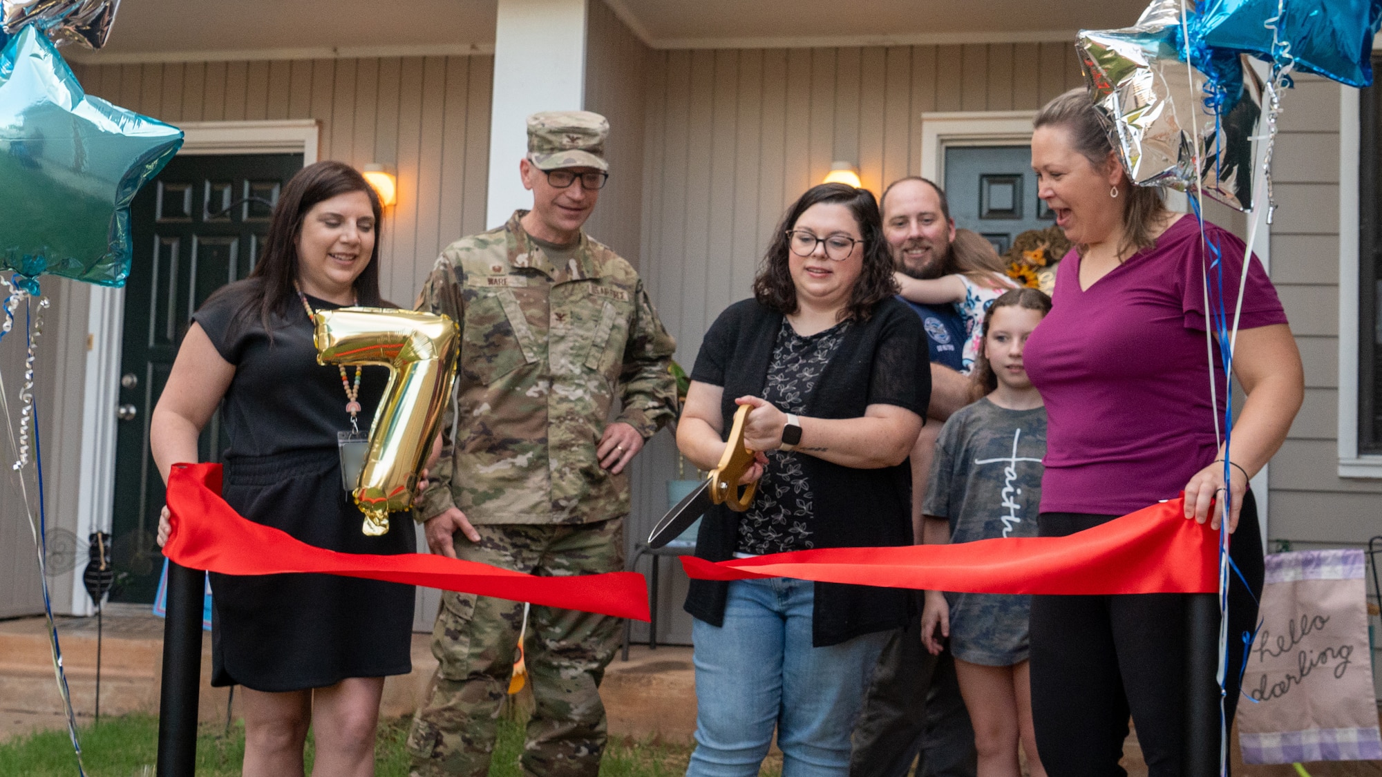 woman cuts ribbon