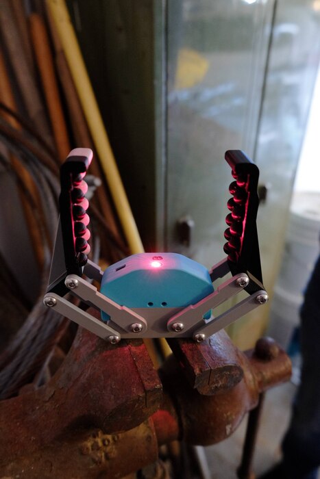 A portion of a robotic system can be seen in this image.