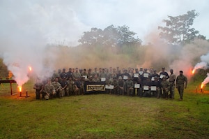 U.S. Air Force defenders assigned to the 822nd Base Defense Squadron, Moody Air Force Base, Georgia, and Panama National Police members pose for a group photo after combined training at a Cerro Tigre range in Panama, 2025. The 822nd BDS is working with U.S. Southern Command as a combined U.S.-Panamanian effort to strengthen relationships and interoperability, expanding the two nations’ strategic security partnership. (U.S. Air Force courtesy photo by Staff Sgt. Sean Williams)