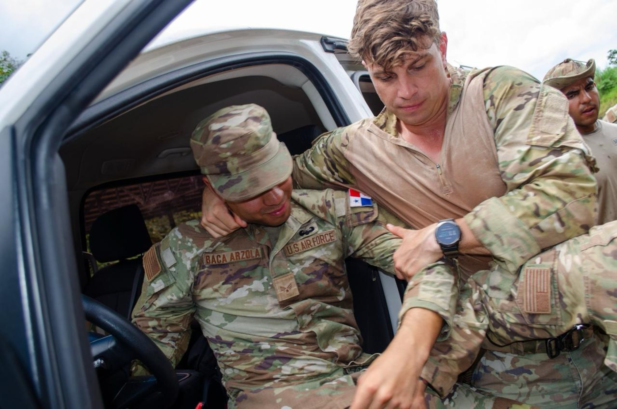 U.S. Air Force security forces Airmen assigned to the 822d Base Defense Squadron, Moody Air Force Base, Georgia, conduct a high risk vehicle traffic stop demonstration for security members from across the Panamanian National Border Service (SENAFRONT), National Aeronaval Service, and Panamanian National Police (PNP), at a Cerro Tigre range in Panama, 2025. The combined training prepared participants to safely handle heightened vehicle interdiction and traffic stop situations. (U.S. Air Force courtesy photo by Staff Sgt. Sean Williams)