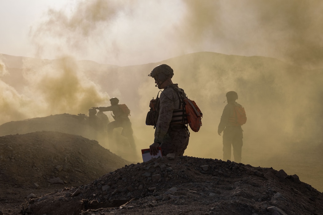 U.S. Marines with Tactical Training and Exercise Control Group, Marine Air Ground Task Force Training Command, Marine Corps Air Ground Combat Center, oversee training during platoon attacks as part of Service Level Training Exercise 4-25, at Range 410A, MCAGCC, Twentynine Palms, California, July 16, 2025. SLTE 4-25 is designed to be a challenging, realistic training environment that produces combat-ready forces capable of operating as an integrated Marine Air Ground Task Force. (U.S. Marine Corps photo by Lance Cpl. Jozef Majewski)
