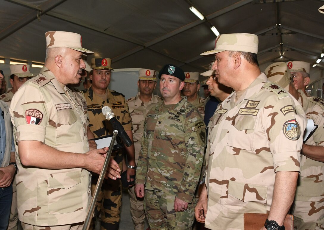 Lt. Gen. Ahmed Khalifa, Chief of Staff of the Egyptian Armed Forces, left, speaks with military personnel from friendly and partner nations participating in the BRIGHT STAR 25 Exercise at Mohamed Naguib Military Base, Aug. 26, 2025. BRIGHT STAR 25 enhances joint readiness and reinforces partner nations’ ability to integrate seamlessly in complex operational environments. By aligning tactics, techniques and procedures, U.S. and partner forces increase their capacity to deter aggression, improving lethality, confidence, and cohesion among multinational service members. (Courtesy photo Department of Morale Affairs, Egyptian Armed Forces – Caption writer, U.S. Central Command Maged Benjamin-Elias)