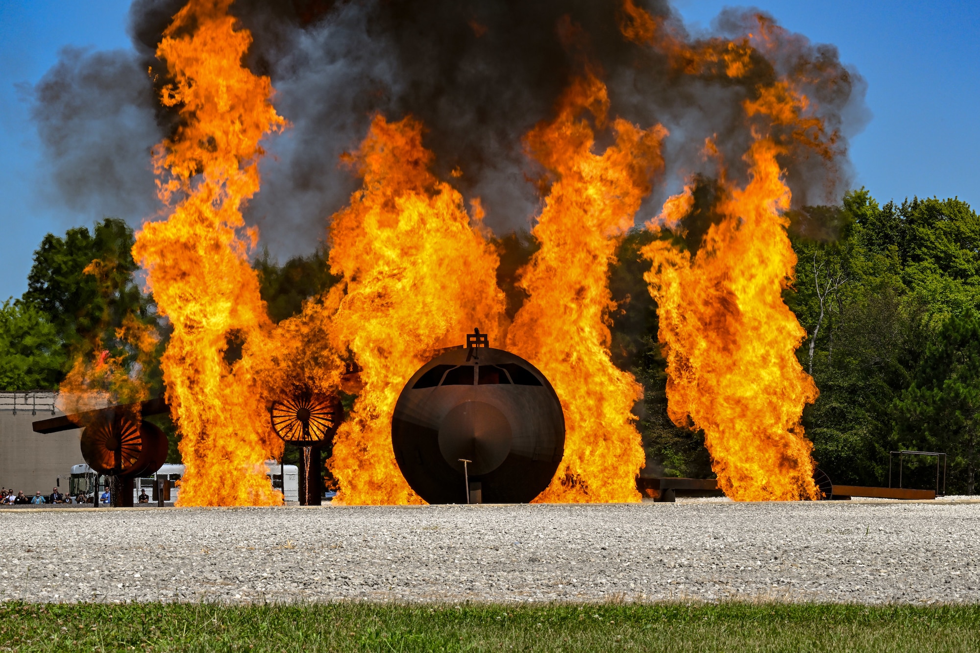 Participants of Employer Day at Youngstown Air Reserve Station, Ohio, observe a firefighting demonstration, Aug. 15, 2025. Reserve Airmen with the 910th Airlift Wing nominated their civilian employers to participate in the community engagement event to raise awareness of military and civilian employment responsibilities in partnership with Employer Support of the Guard and Reserve. (U.S. Air Force photo by Staff Sgt. Christina Russo)