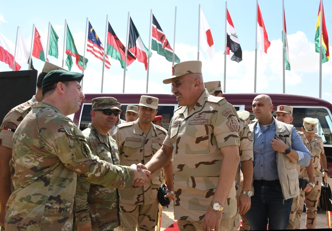 Lt. Gen. Ahmed Khalifa, right, Chief of Staff of the Egyptian Armed Forces, arrives to oversee BRIGHT STAR 2025 preparations, greeted by U.S. Army Brig. Gen. Patrick Clare, Bright Star 25 exercise director, and Col. Jason Wimberly, embassy Defense Attaché, and Egyptian officers at Mohamed Naguib Military Base, Aug. 26, 2025. BRIGHT STAR 25 enhances joint readiness and reinforces partner nations’ ability to integrate seamlessly in complex operational environments. By aligning tactics, techniques and procedures, U.S. and partner forces increase their capacity to deter aggression, improving lethality, confidence, and cohesion among multinational service members. (Courtesy photo Department of Morale Affairs, Egyptian Armed Forces – Caption writer, U.S. Central Command Maged Benjamin-Elias)