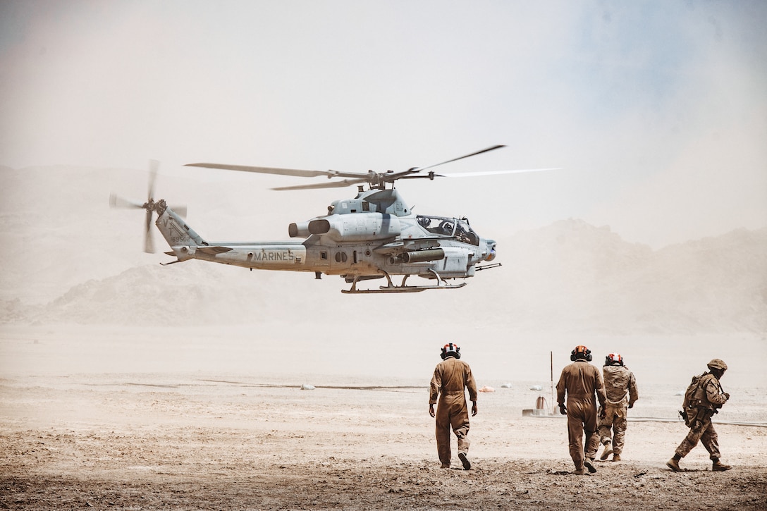 A U.S. Marine Corps AH-1Z Viper, assigned to Marine Light Attack Helicopter Squadron (HMLA) 367, Marine Aircraft Group 39, 3rd Marine Aircraft Wing, lands to refuel during a Forward Arming and Refueling Point as part of Service Level Training Exercise 4-25 at Marine Corps Air Ground Combat Center, Twentynine Palms, California, Aug. 6, 2025. MCAGCC serves as the Marine Corps’ premier training venue for service-level exercises by providing realistic multi-domain environments to prepare forces for success in future conflicts. (U.S. Marine Corps photo by Lance Cpl. Dominic Spence)
