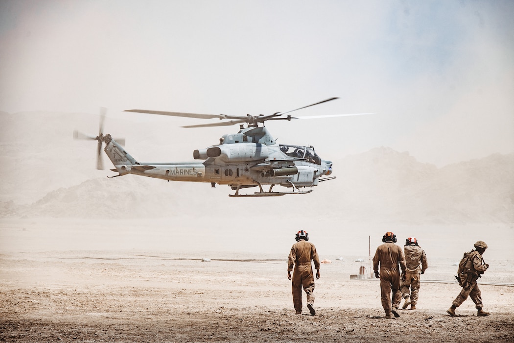 A U.S. Marine Corps AH-1Z Viper, assigned to Marine Light Attack Helicopter Squadron (HMLA) 367, Marine Aircraft Group 39, 3rd Marine Aircraft Wing, lands to refuel during a Forward Arming and Refueling Point as part of Service Level Training Exercise 4-25 at Marine Corps Air Ground Combat Center, Twentynine Palms, California, Aug. 6, 2025. MCAGCC serves as the Marine Corps’ premier training venue for service-level exercises by providing realistic multi-domain environments to prepare forces for success in future conflicts. (U.S. Marine Corps photo by Lance Cpl. Dominic Spence)
