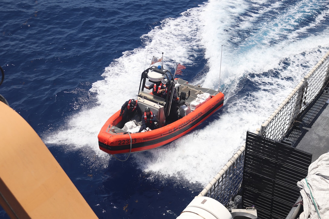 A Coast Guard Cutter Vigilant (WMEC 617) small boat crew transfers illicit drugs seized from a go-fast style vessel back to the cutter in the Caribbean Sea, Aug. 15, 2025. The crew of Vigilant conducted a two-month, maritime border security patrol in the Windward Passage and Caribbean Sea to protect America’s maritime borders and counter illicit drug smuggling in the region. (U.S. Coast Guard photo)