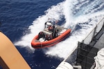 A Coast Guard Cutter Vigilant (WMEC 617) small boat crew transfers illicit drugs seized from a go-fast style vessel back to the cutter in the Caribbean Sea, Aug. 15, 2025. The crew of Vigilant conducted a two-month, maritime border security patrol in the Windward Passage and Caribbean Sea to protect America’s maritime borders and counter illicit drug smuggling in the region. (U.S. Coast Guard photo)