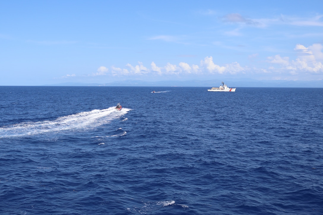 A Coast Guard Cutter Vigilant (WMEC 617) small boat crew conducts an at-sea transfer of seized contraband with Coast Guard Cutter Alert (WMEC 630) in the Caribbean Sea, Aug. 16, 2025. The crew of Vigilant conducted a two-month, maritime border security patrol in the Windward Passage and Caribbean Sea to protect America’s maritime borders and counter illicit drug smuggling in the region. (U.S. Coast Guard photo)