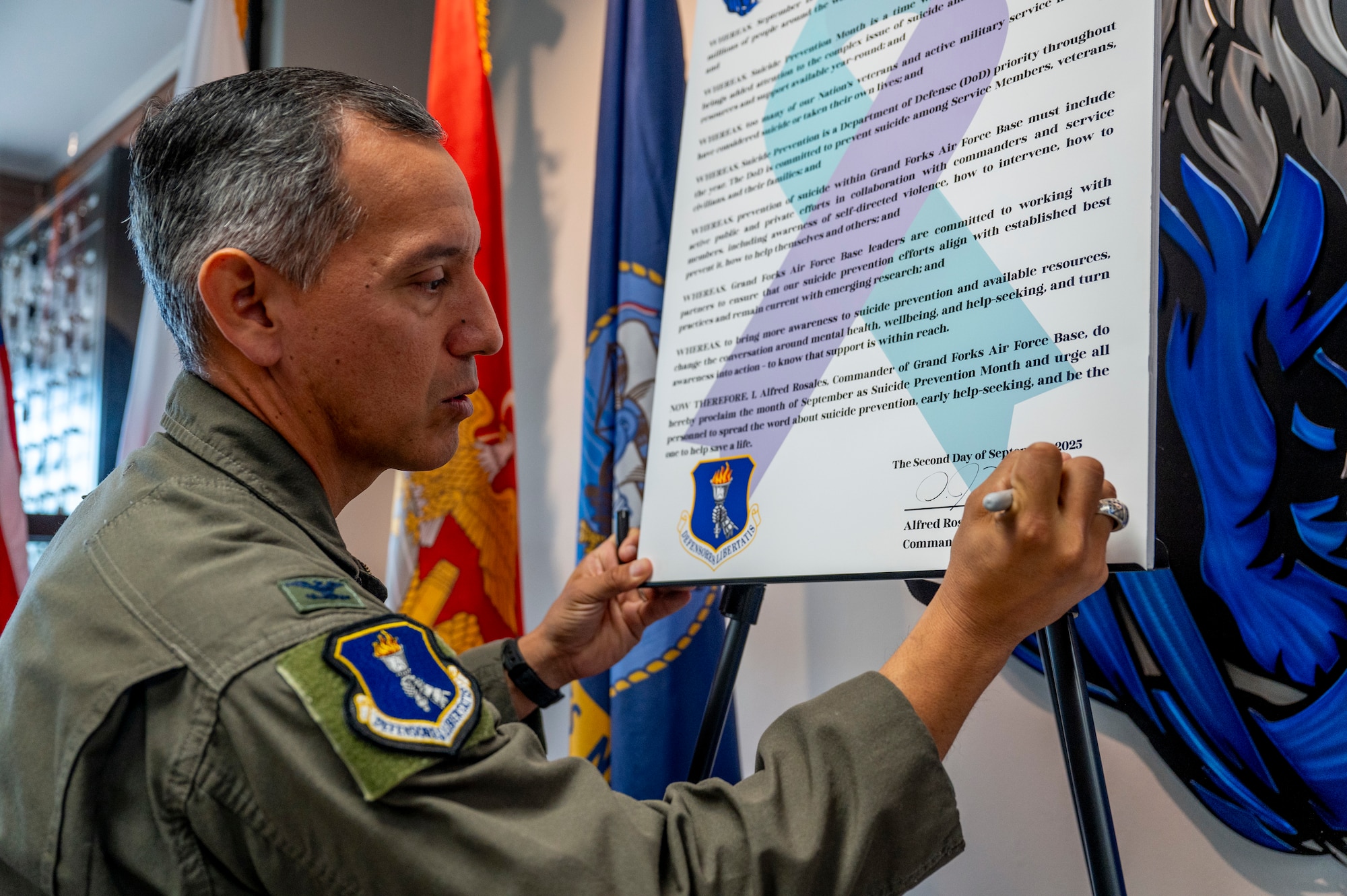 Col. Alfred Rosales, 319th Reconnaissance Wing commander, reads the 2025 Suicide Prevention Month Proclamation at Grand Forks Air Force Base, North Dakota, Aug. 25, 2025.