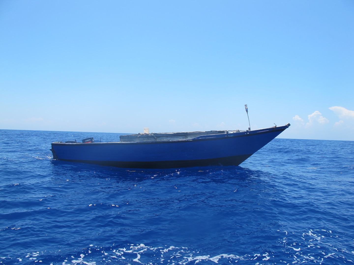 A law enforcement boat crew from USCGC Spencer (WMEC 905) intercepts an overloaded vessel with 191 Haitian aliens approximately 40 miles north of Cap Haitian, Haiti, Aug 29, 2025. The aliens were repatriated to Haiti, Sept 2, 2025 following the interdiction. (U.S. Coast Guard photo)