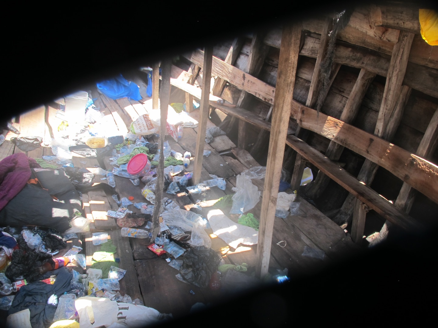 Debris is left on the deck of an overloaded vessel carrying 191 Haitian aliens approximately 40 miles north of Cap Haitian, Haiti, Aug 29, 2025. A law enforcement boat crew from USCGC Spencer (WMEC 905) intercepted the overloaded vessel and repatriated all aliens aboard back to Haiti, Sept 2, 2025. (U.S. Coast Guard photo)