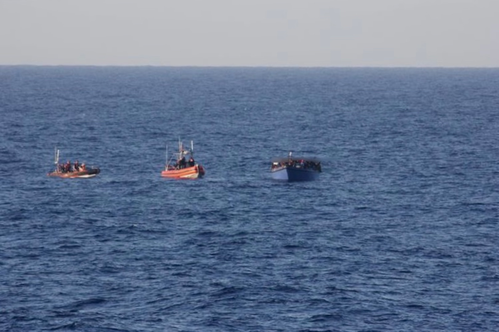 Law enforcement boat crews from USCGC Spencer (WMEC 905) intercept an overloaded vessel with 191 Haitian aliens approximately 40 miles north of Cap Haitian, Haiti, Aug 29, 2025. All aliens aboard the vessel were repatriated back to Haiti, Sept 2, 2025 following the interdiction. (U.S. Coast Guard photo)