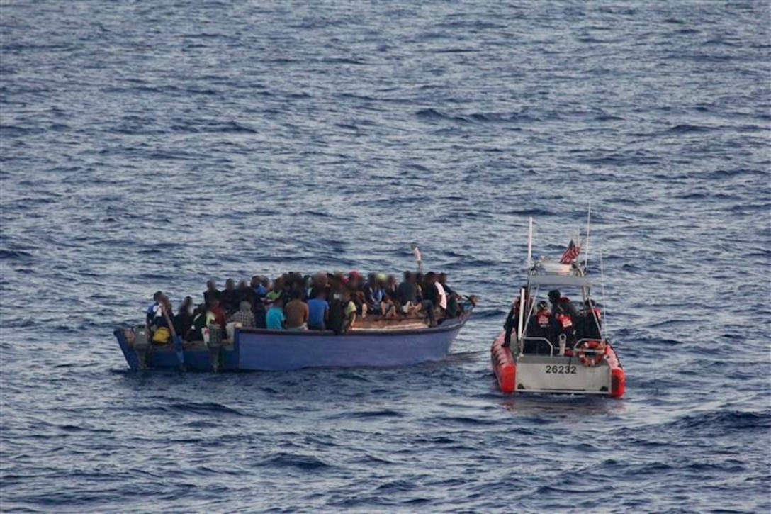 A law enforcement boat crew from USCGC Spencer (WMEC 905) intercepts an overloaded vessel with 191 Haitian aliens approximately 40 miles north of Cap Haitian, Haiti, Aug 29, 2025. All aliens aboard the vessel were repatriated back to Haiti, Sept 2, 2025 following the interdiction. (U.S. Coast Guard photo)