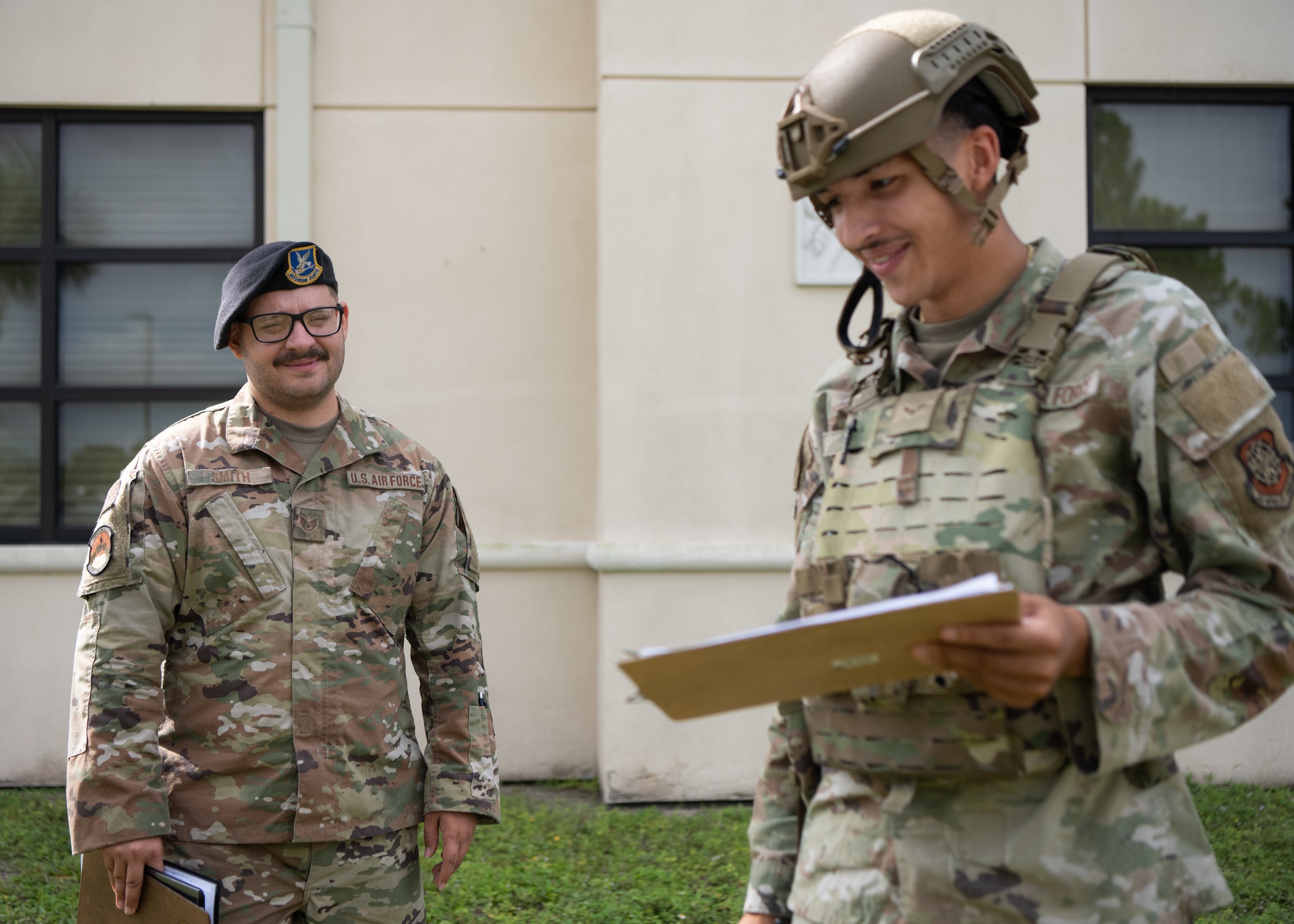 U.S. Air Force Staff Sgt. Dakotah Smith, left, an evaluator with the 6th Security Forces Squadron, assesses Airman 1st Class Jaylaun Hardy, a defender assigned to the 6th SFS, while he conducts security procedures at MacDill Air Force Base, Florida, Aug. 26, 2025.