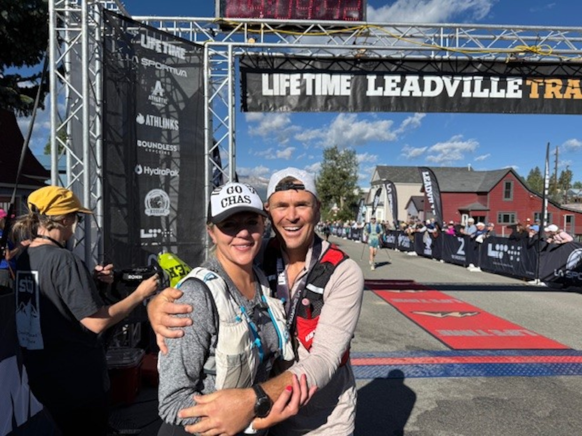 U.S. Air Force Lt. Col. Richard Kabanuck, 47th Operations Group deputy commander, right, and his wife, left, pose for a picture at the finish line of the Leadville Trail 100 Run in Leadville, Colorado, Aug. 16, 2025. This was the third Leadville Trail 100 Run Kabanuck has completed, totaling 28 100+ mile races in his career. (Courtesy photo)