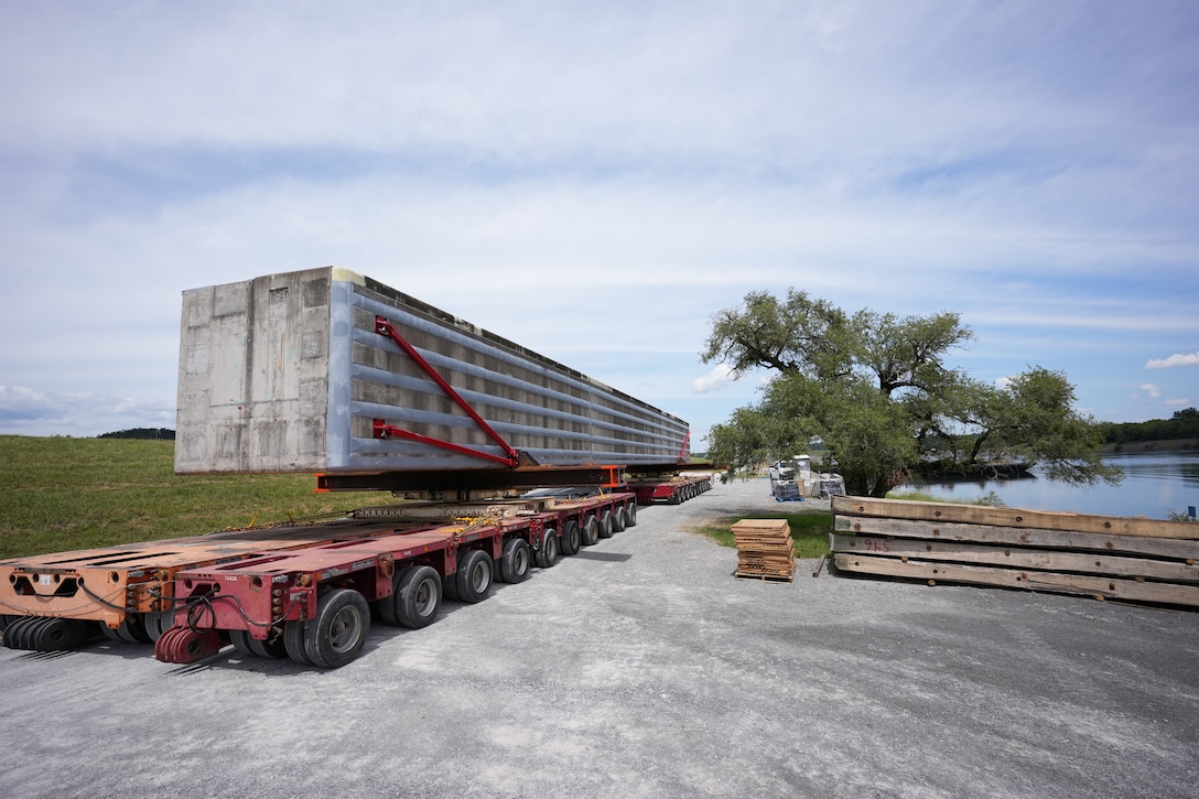 SPRING CITY, Tenn. — A prefabricated wall beam awaits barge delivery to the Chickamauga Lock Replacement Project’s upstream approach wall contract near Watts Bar Dam Aug. 28, 2025. (USACE photo by Noe Gonzalez)