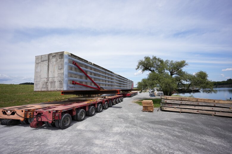SPRING CITY, Tenn. — A prefabricated wall beam awaits barge delivery to the Chickamauga Lock Replacement Project’s upstream approach wall contract near Watts Bar Dam Aug. 28, 2025. (USACE photo by Noe Gonzalez)