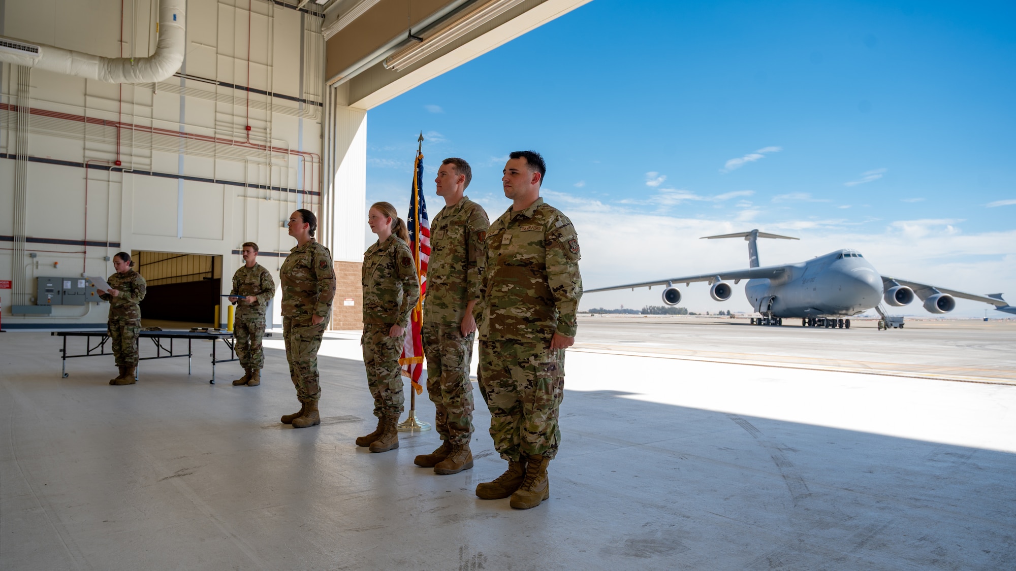 Airmen stand at attention during a recognition ceremony