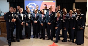 Laughlin Air Force Base graduates of Airman Leadership School (ALS) Class 25-F join base leadership for a group photo after an ALS graduation ceremony at XL Landings, Aug. 28, 2025.  ALS is a two-week course that provides Airmen tools to succeed in supervisory roles.  (U.S. Air Force Photo by Airman 1st Class Darryl Keith.)