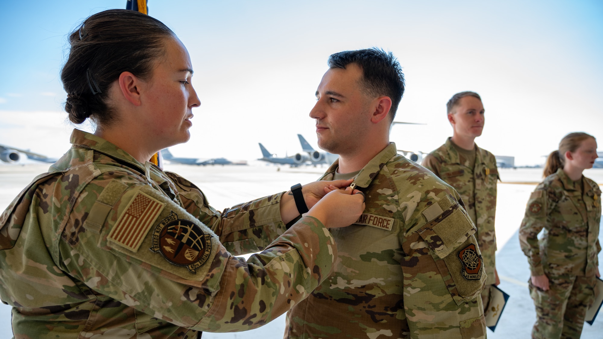 An Airman is presented an award