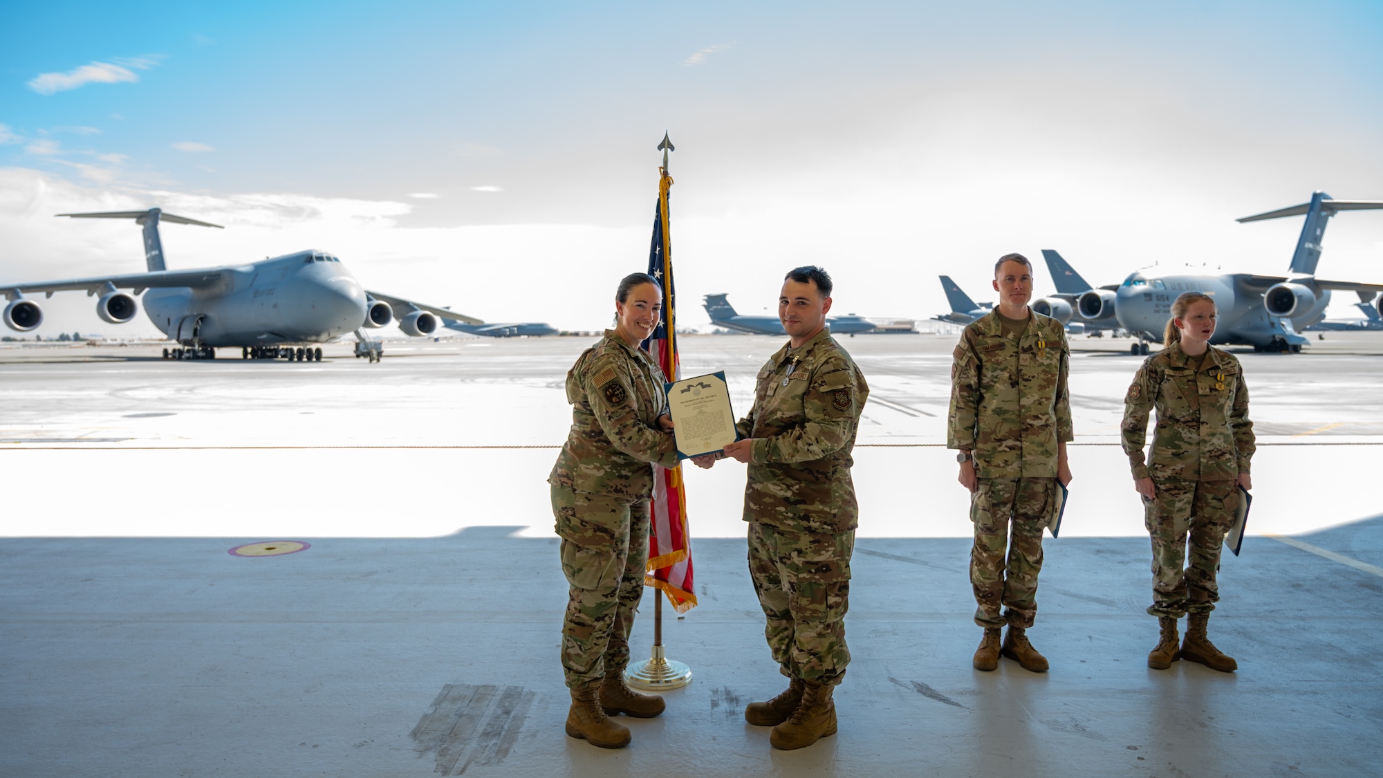 An Airman is presented an award