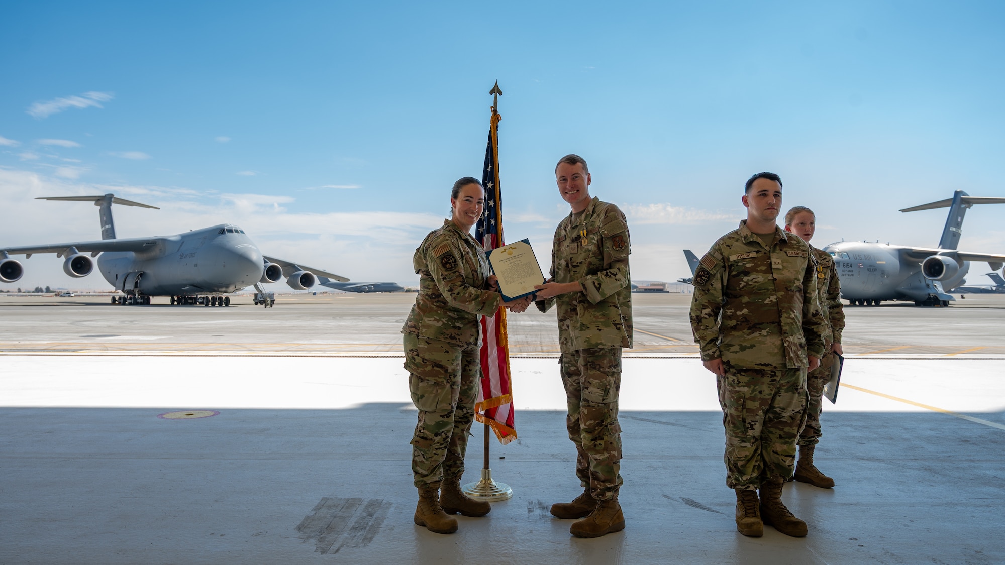 An Airman is presented an award