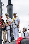 NAVAL BASE GUAM (August 31, 2025) Cmdr. Greg Storer, commanding officer, USS Springfield (SSN 761), left, and Lt. Cmdr. Juan Diaz, center, man the conning tower of the Los Angeles-class fast-attack submarine, August 31, 2025. Springfield returns to Guam after completing a routine deployment in the Indo-Pacific. Assigned to Commander, Submarine Squadron 15, based at Polaris Point, Naval Base Guam, Springfield is one of five forward-deployed fast-attack submarines. Renowned for their unparalleled speed, endurance, stealth, and mobility, fast-attack submarines are the backbone of the Navy’s submarine force. Regarded as apex predators of the sea, Guam’s fast-attack submarines serve at the tip of the spear, helping to reaffirm the submarine force's forward-deployed presence in support of a free and open Indo-Pacific. (U.S. Navy photo by Lt. James Caliva)