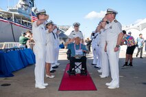 World War II Navy veteran John DeLeo is welcomed during a ceremony commemorating the 80th anniversary of the end of World War II in Pearl Harbor, Hawaii, Sept. 2, 2025.