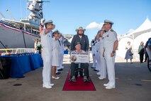 World War II Navy veteran Delmar Beard is welcomed during a ceremony commemorating the 80th anniversary of the end of World War II in Pearl Harbor, Hawaii, Sept. 2, 2025.