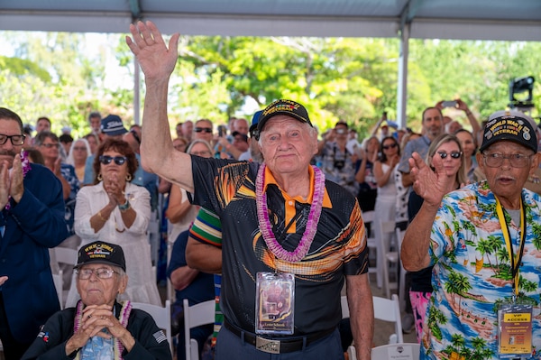 World War II veterans are applauded during a ceremony commemorating the 80th anniversary of the end of World War II in Pearl Harbor, Hawaii, Sept. 2, 2025.