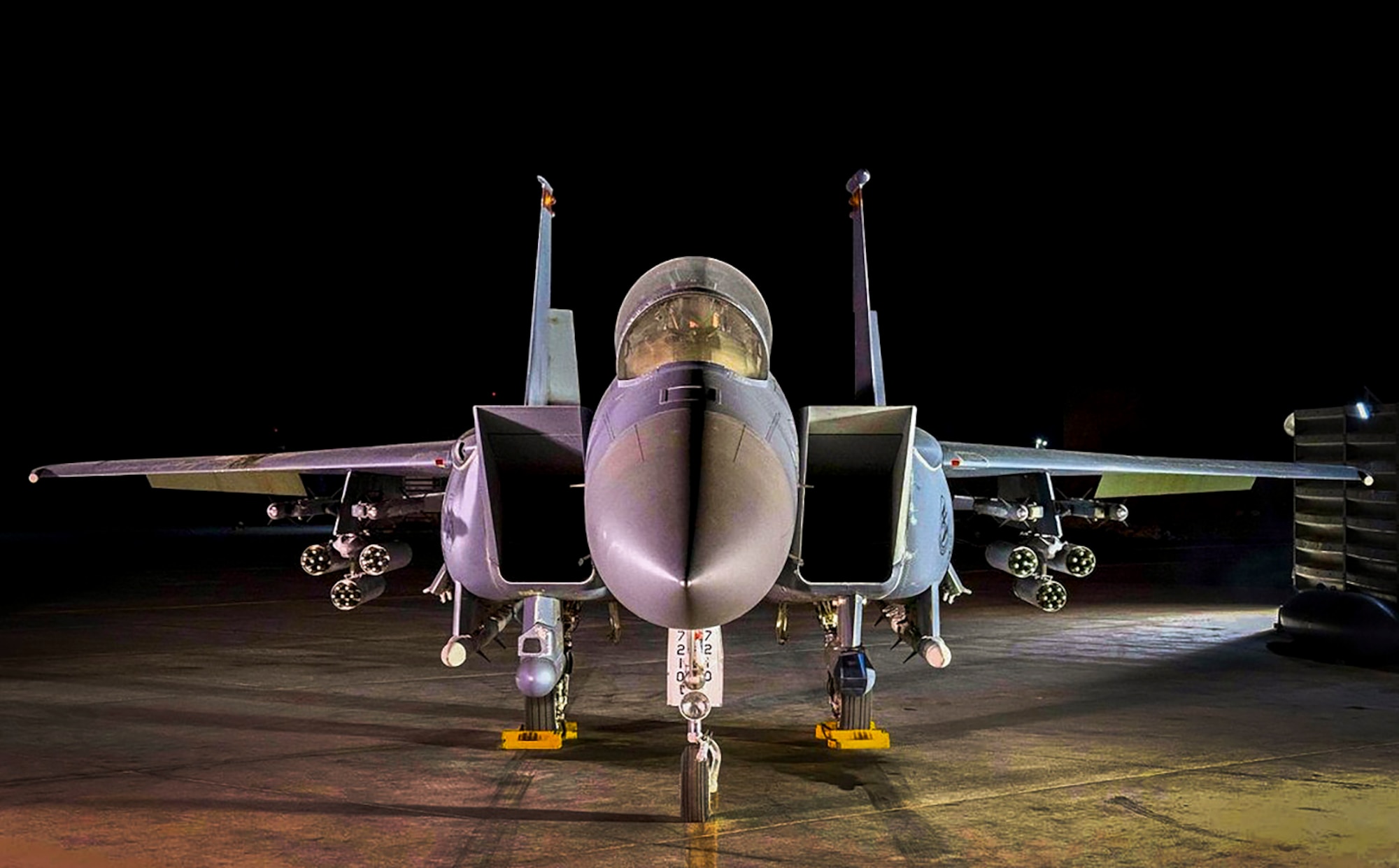 An F-15E Strike Eagle loaded up with AGR-20F Advanced Precision Kill Weapon System II laser-guided rockets waits for its next mission.