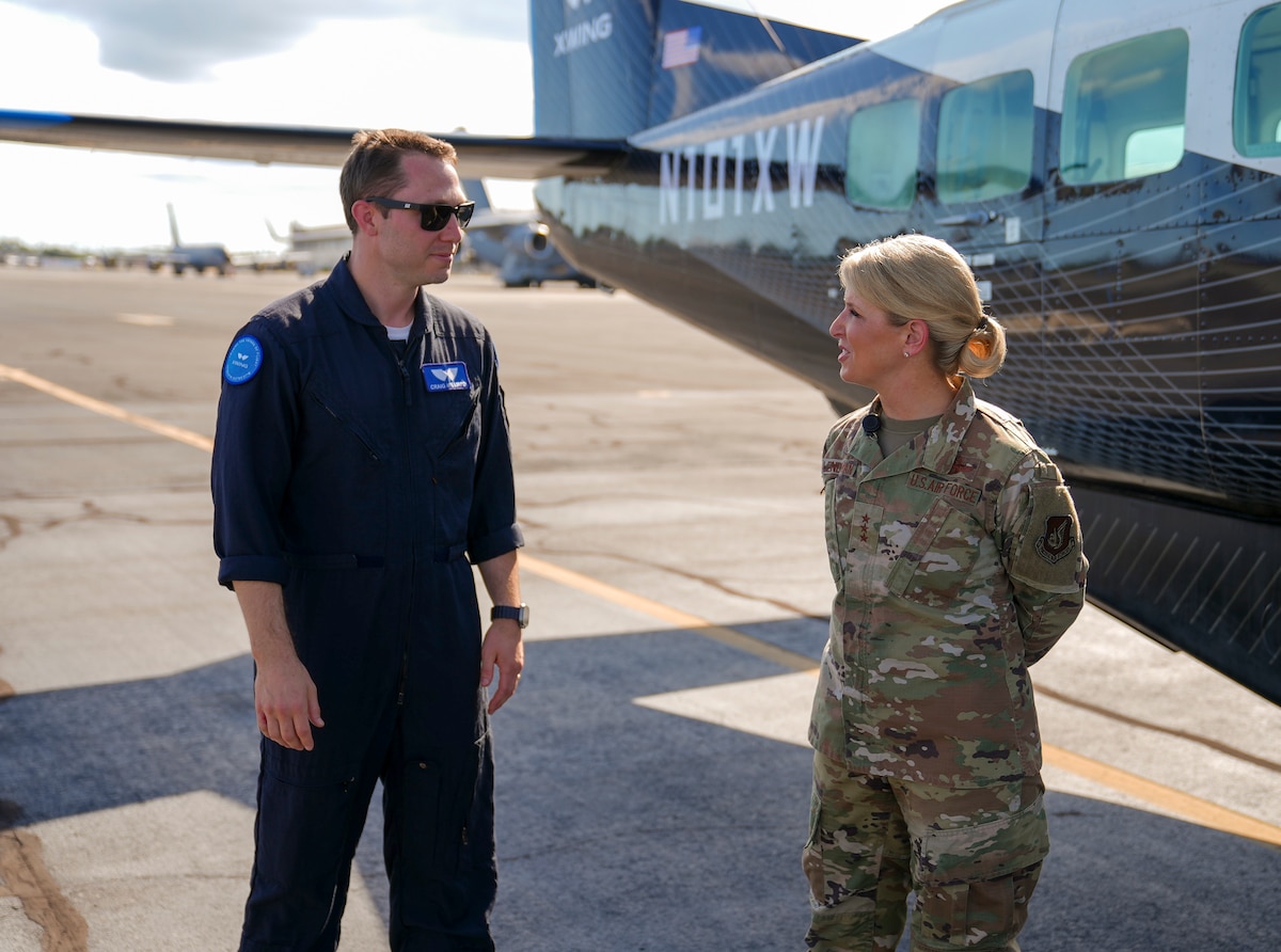 Craig Milliard, Joby flight test lead, briefs Lt. Gen. Laura Lenderman, Pacific Air Forces deputy commander, on the autonomous capabilities of the Joby Aviation Cessna 208B Grand Caravan during the Department-Level Exercise at Joint Base Pearl Harbor-Hickam, Hawaii, July 28, 2025.
