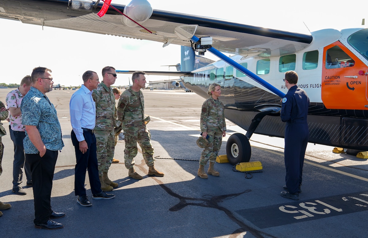 Craig Milliard, Joby flight test lead, briefs, from right, Lt. Gen. Laura Lenderman, Pacific Air Forces deputy commander, Brig. Gen. Shane Vesely, PACAF chief of staff, Brig. Gen. Mike Zuhlsdorf, PACAF director of logistics, engineering and force protection, and Dr. Michael Durstock, Pacific Air Forces chief science and technology advisor, on the autonomous capabilities of the Joby Aviation Cessna 208B Grand Caravan during the Department-Level Exercise at Joint Base Pearl Harbor-Hickam, Hawaii, July 28, 2025.