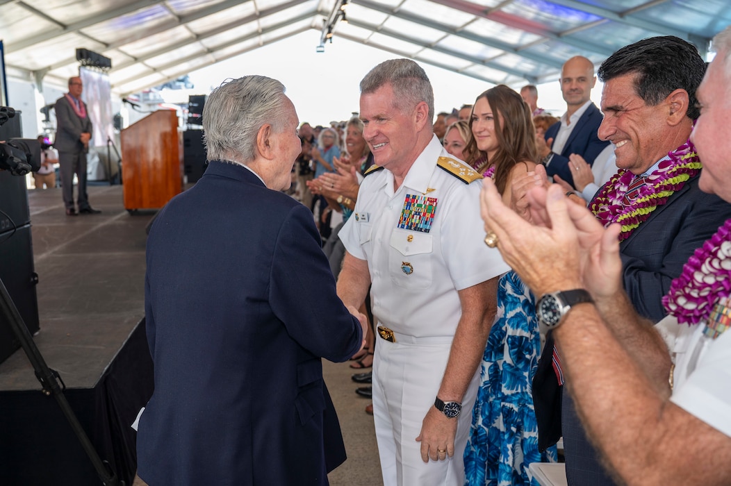 Adm. Samuel J. Paparo, commander of U.S. Indo-Pacific Command, shakes hands with World War II Navy veteran Gunner's Mate 2nd Class Edgar Buffman during a ceremony commemorating the 80th anniversary of the end of World War II in Pearl Harbor, Hawaii, Sept. 2, 2025.