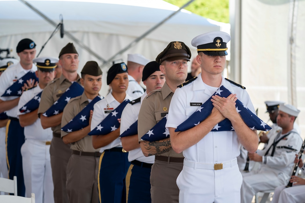 Members of the Hawaii Army and Navy Reserve Officers' Training Corps conduct a flag presentation during a ceremony commemorating the 80th anniversary of the end of World War II in Pearl Harbor, Hawaii, Sept. 2, 2025.