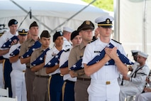 Members of the Hawaii Army and Navy Reserve Officers' Training Corps conduct a flag presentation during a ceremony commemorating the 80th anniversary of the end of World War II in Pearl Harbor, Hawaii, Sept. 2, 2025.