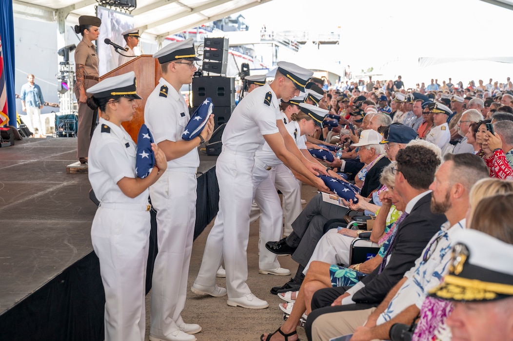 Members of the Hawaii Army and Navy Reserve Officers' Training Corps present flags to World War II veterans during a ceremony commemorating the 80th anniversary of the end of World War II in Pearl Harbor, Hawaii, Sept. 2, 2025.
